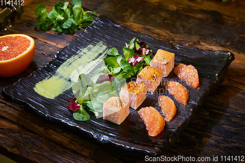 Image of Slow Cooked Salmon fillet steak with salad on plate, Sous-Vide Cooking Salmon Fish