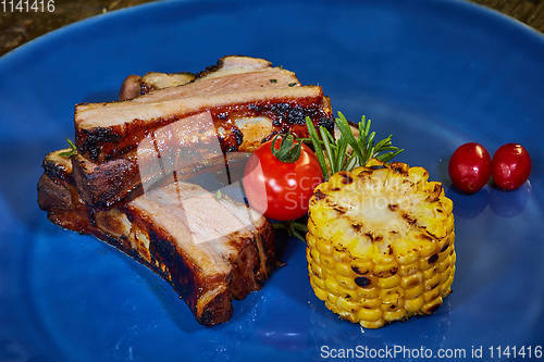 Image of Roasted sliced barbecue pork ribs, focus on sliced meat