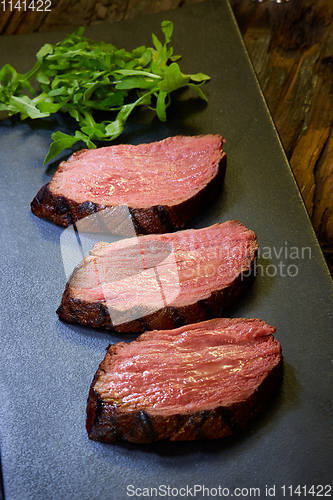 Image of Sous-vide steak cut into pieces, cooked to eat beef on the stone table