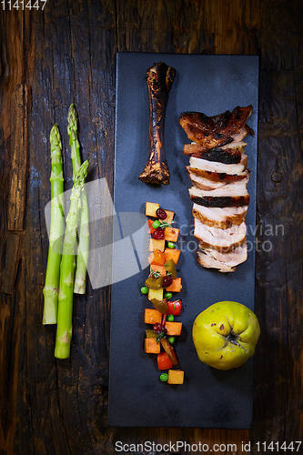 Image of Roasted sliced barbecue pork ribs, focus on sliced meat