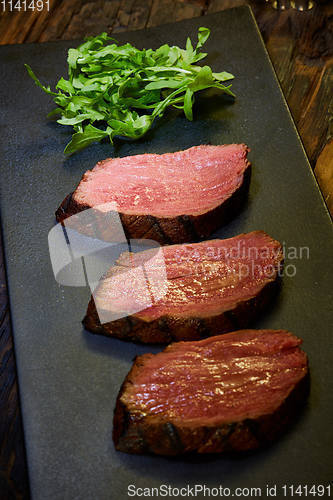 Image of Sous-vide steak cut into pieces, cooked to eat beef on the stone table