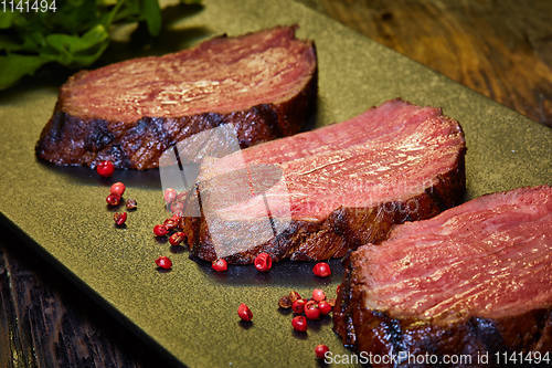 Image of Sous-vide steak cut into pieces, cooked to eat beef on the stone table