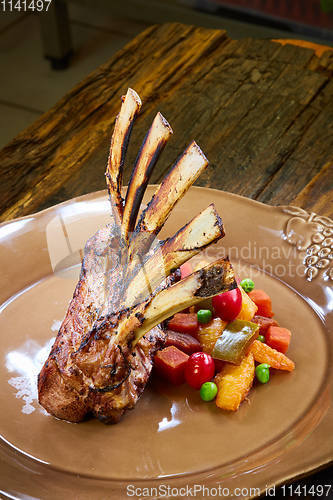 Image of Lamb rack with limoncello glaze served on a plate