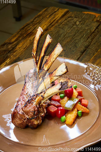 Image of Lamb rack with limoncello glaze served on a plate