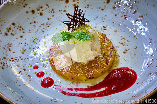 Image of Grilled pineapple with scoops of vanilla ice cream