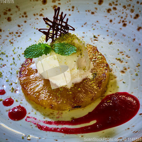 Image of Grilled pineapple with scoops of vanilla ice cream