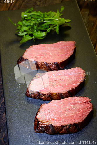 Image of Sous-vide steak cut into pieces, cooked to eat beef on the stone table