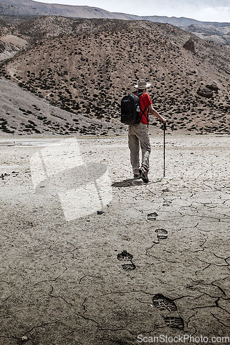 Image of Mountaineer trekker walking in Himalayas