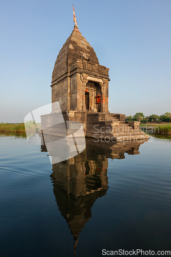 Image of Small Hindu temple in the middle of the holy Narmada River, Maheshwar, Madhya Pradesh state, India