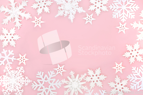 Image of Festive Christmas Magical Ornate Snowflake Pink Background