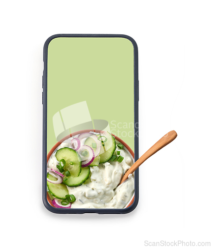 Image of bowl of greek yogurt in the smartphone screen