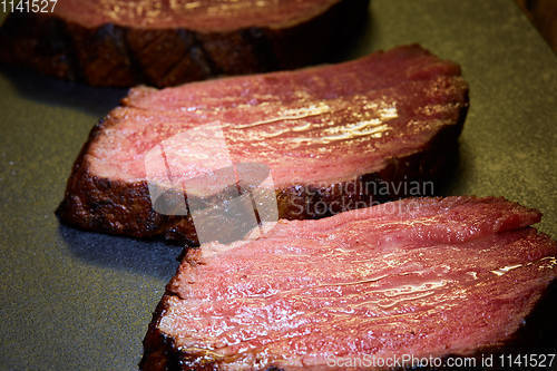 Image of Sous-vide steak cut into pieces, cooked to eat beef on the stone table