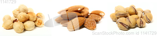 Image of A set of three kinds of nuts. Three heaps of nuts, pistachios, almonds and hazelnuts.