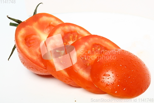 Image of Fresh organic sliced tomato on white background. Top view