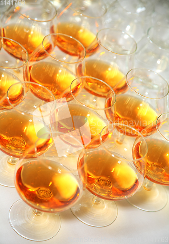 Image of Beautiful rows of glasses of whiskey or cognac