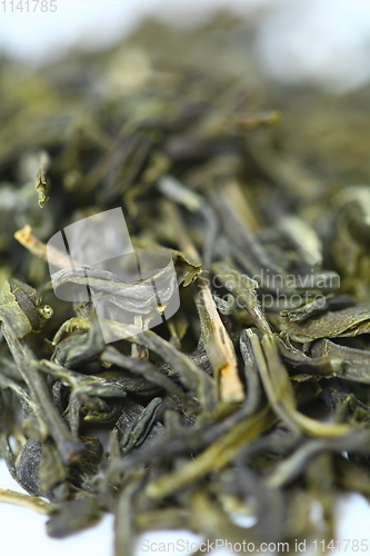 Image of Pile of green tea on white background. Shallow dof