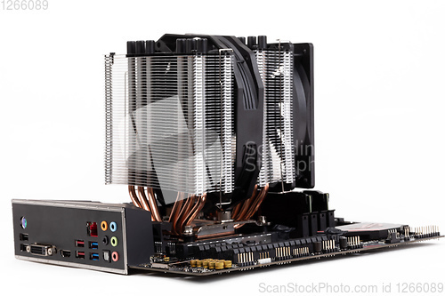 Image of PC mainboard with CPU cooler on white