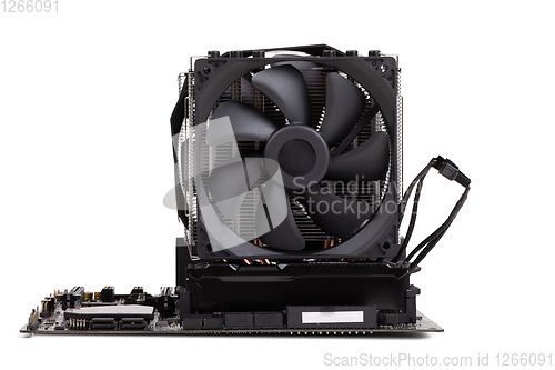 Image of PC mainboard with CPU cooler on white