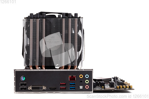 Image of PC mainboard with CPU cooler on white