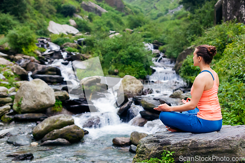 Image of Woman in Padmasana outdoors