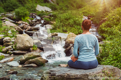 Image of Yoga outdoors - Padmasana asana lotus pose