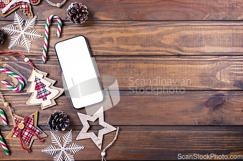 Image of Smartphone mock up with rustic Christmas decorations