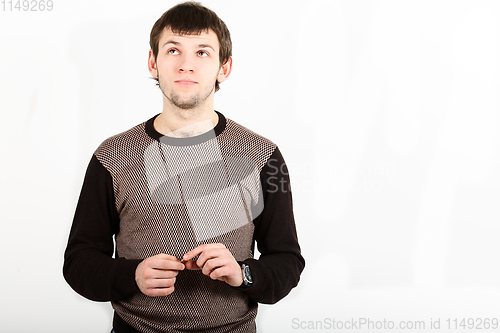 Image of The romantic young man looking upwards isolated on white background