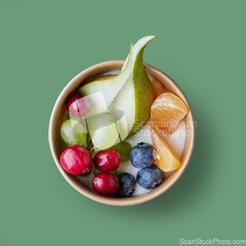 Image of fresh fruit and berries in paper cup