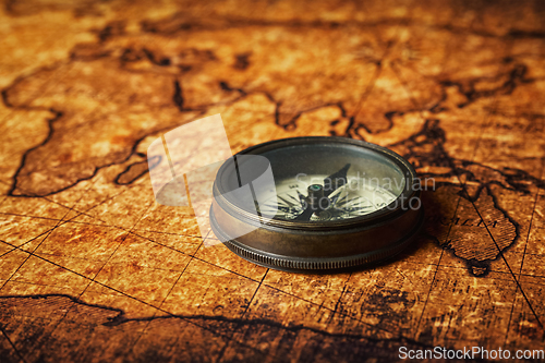 Image of Old vintage compass on ancient map