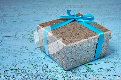 Image of Gift box with blue ribbon