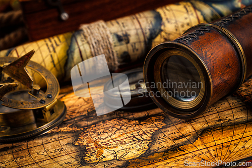 Image of Old vintage compass and navigation instruments on ancient map