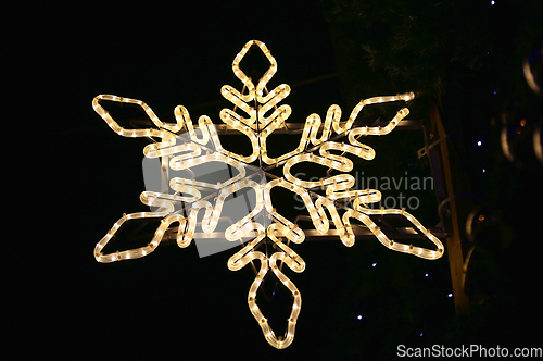 Image of Beautiful christmas decoration, bright glowing neon snowflake