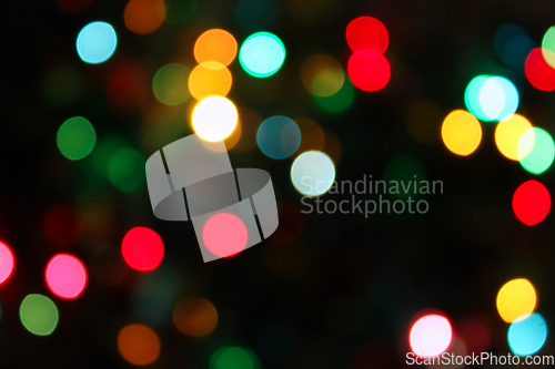 Image of Colorful festive blurry lights of Christmas decorations