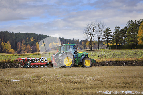 Image of John Deere 7530 Tractor Plowing Stubble Field in Autumn