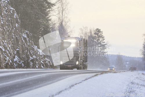 Image of Volvo FH Timber Truck Headlights in Winter Snowfall