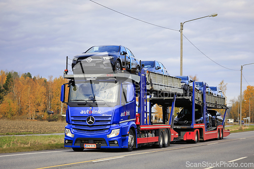 Image of Blue Mercedes-Benz Actros Vehicle Carrier Transports New Cars
