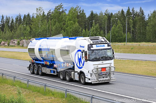 Image of Volvo FH Truck Pulls Three Compartment Tank Trailer on Road