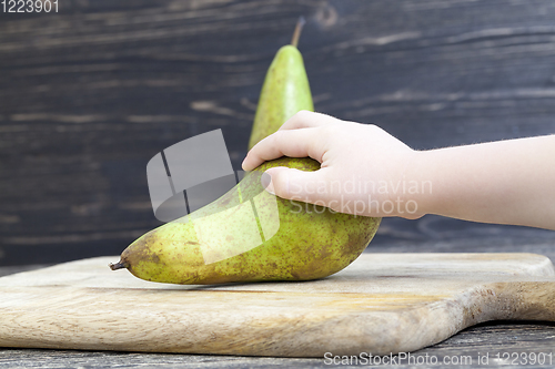 Image of two old green pears