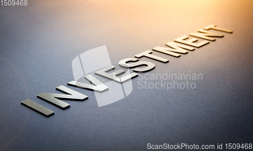 Image of Word investment written with white solid letters