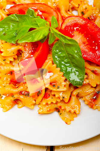 Image of Italian pasta farfalle butterfly bow-tie and tomato sauce