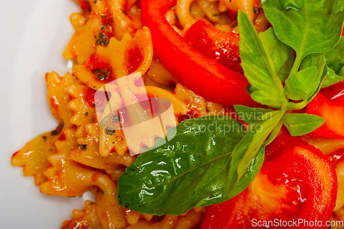 Image of Italian pasta farfalle butterfly bow-tie and tomato sauce