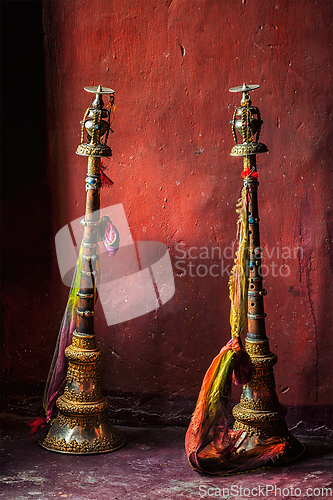 Image of Buddhist prayer horns in Tibetan monastery