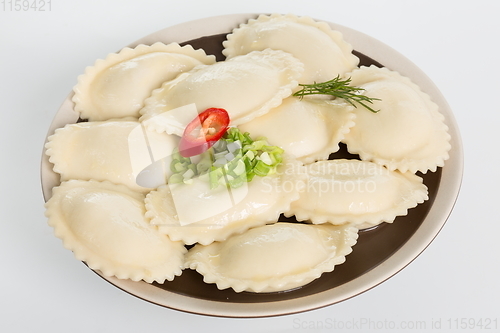 Image of Vareniki or dumplings, pierogi before boiling - traditional Ukrainian food