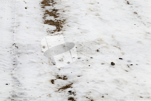 Image of Snow drifts in winter road