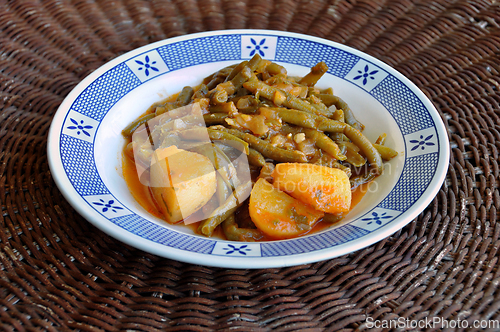 Image of green beans with tomato sauce