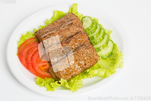 Image of Three fried breaded cutlet with lettuce, tomatoes and cucumbers on white background