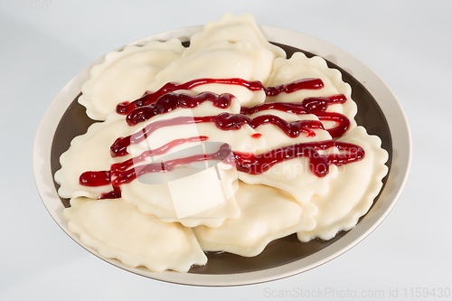 Image of Delicious dumplings with cherries. Shallow dof