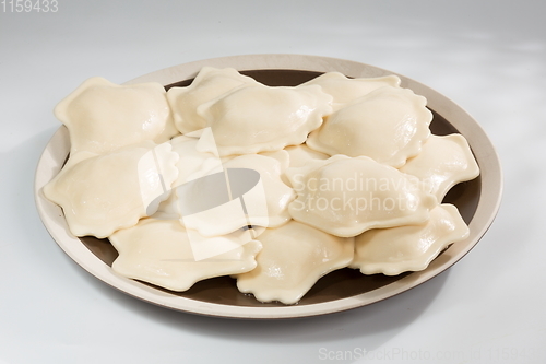 Image of Vareniki or dumplings, pierogi before boiling - traditional Ukrainian food