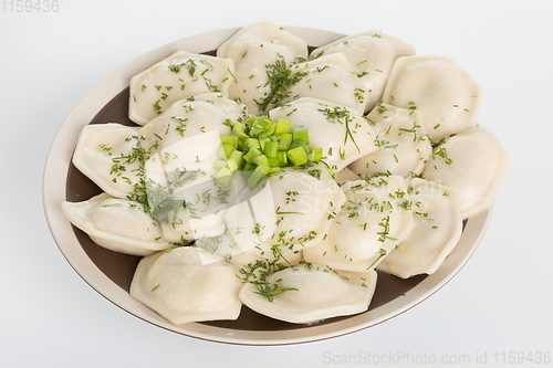 Image of Vareniki or dumplings, pierogi before boiling - traditional Ukrainian food