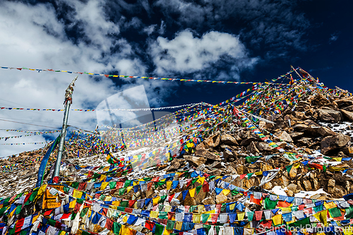 Image of Tibetan Buddhist prayer flags on top of Khardung La pass. Highest motorable pass in the world 5602 m
